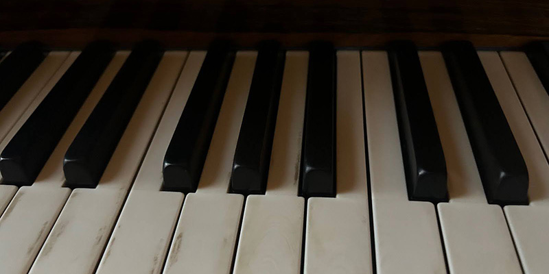 Ivory piano keys on a Blüthner grand piano at Brodie Castle. Photo by Molly Brown.